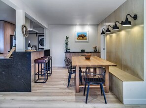 Gather around our custom farm table by The Canary Workshop, the heart of our cozy, farmhouse-style dining area. It's where meals and memories are made.