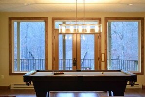 Full size pool table in large recreation room