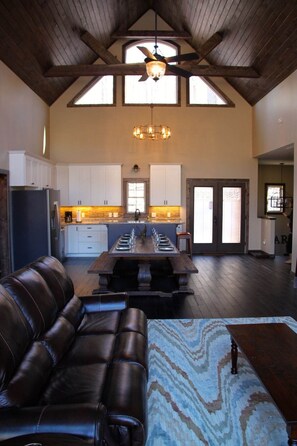 A comfortable living room greets guests on the top level