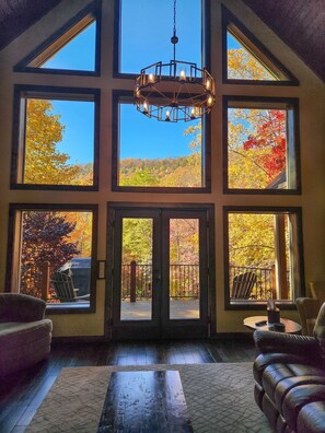 Enjoy the beauty of the mountains through the huge living room windows