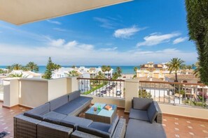 Seating area facing the ocean on back terrace