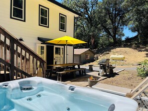 Enjoy a soak in the hot tub located in private back yard area.
