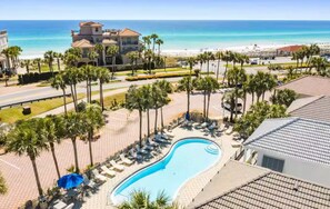 Relax by the sparkling pool with stunning Gulf views just steps from the beach.