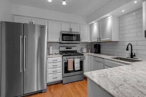 Quartz countertops and stainless appliances
