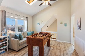 The Top-Level Game Room with a Foosball Table is perfect for family fun!