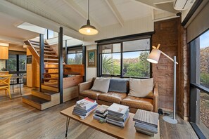 Ground floor living area with smart tv and open fireplace