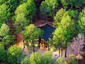 Escape to Woodsy Wonder – Your ultimate retreat surrounded by nature! Enjoy endless fun with a playset, pool table, shuffleboard, and an arcade, all tucked away in the serene beauty of the forest. Perfect for family adventures and unforgettable memories!