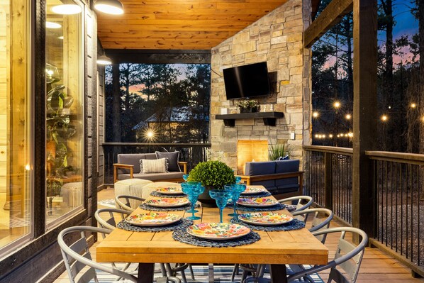 Enjoy meals outside while watching on our SMART TV