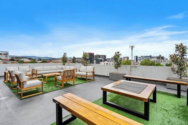 The private outdoor terrace is ideal for enjoying evening drinks with family and friends against the stunning backdrop of Hobart's skyline and beyond.