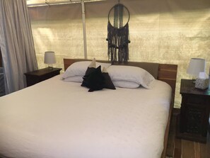King size bed made with lofty duvet and linens
