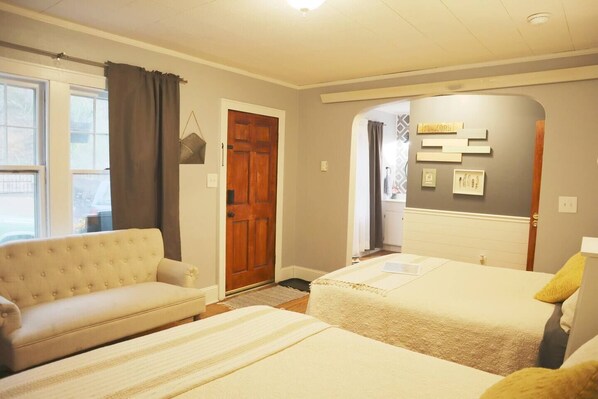 Front bedroom with two queen beds and private bath.