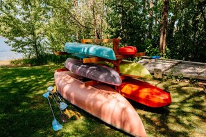 Single and tandem kayaks, one canoe