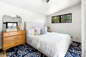 Immaculate Bedroom with Luxury Linens and Cozy Touches
