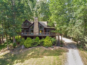 First impressions matter! The front of this home is a stunning blend of lush greenery and beautiful landscaping. A true mountain escape.