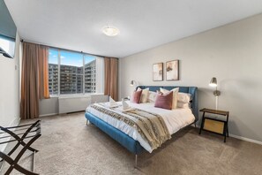 Step into this cozy bedroom, where plush pillows and a soft, inviting blanket await you. Imagine yourself sinking into the bed after a long day, surrounded by layers of comfort that make it easy to drift off to sleep.