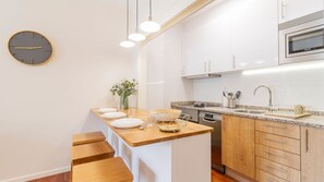 Your culinary adventures start here in our well-stocked kitchenette. #CulinaryAdventures #WellStocked