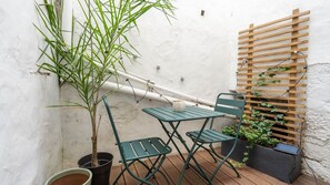 Step outside to our charming little patio, your private oasis in the city." #PatioParadise #UrbanEscape #PrivateOasis