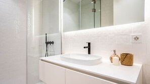 Clean and pristine bathroom featuring a refreshing shower, adorned in white for a fresh and immaculate experience.
#bathroom #clean