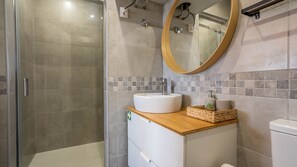 Unwind in our bathroom featuring a refreshing shower—a simple and serene space for your relaxation. #ShowerSanctuary #SimpleBathroomBliss