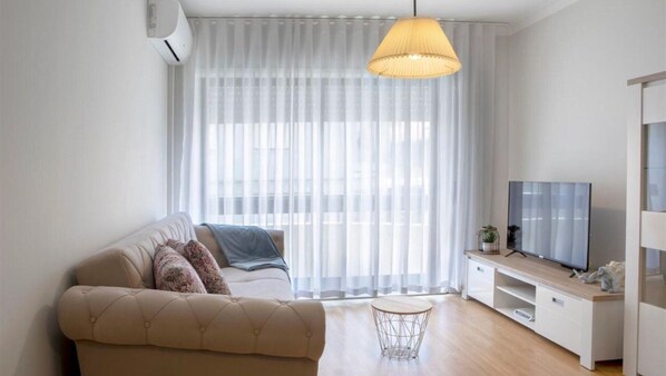 Relax in style in our cozy living room, complete with modern furnishings and refreshing air conditioning. #airbnb #cozy