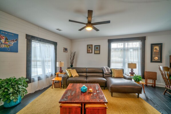 Spacious living area with ample seating and Smart TV