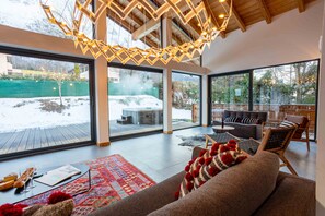 Living room with floor to ceiling windows