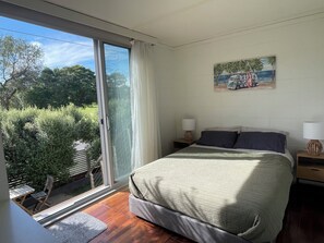 Main bedroom with outlook over the park and north facing courtyard.