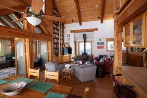 View from the dining room to the living room- games, puzzles, cards available.