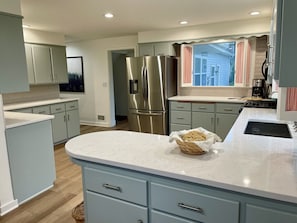 The kitchen is truly equipped for cooking and baking family meals.