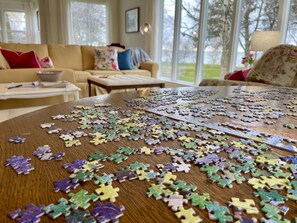 Pick out a game or puzzle to enjoy at the living room table.