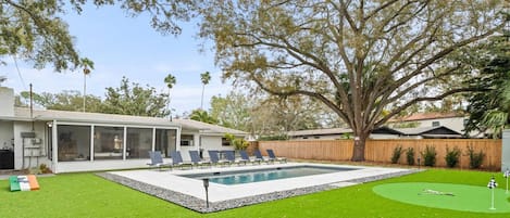 This 3 bedroom 2 bath pool home with private fenced backyard and custom putting green is ready for your stay!