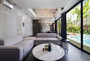 Living room with a pool view