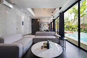 Living room with a pool view