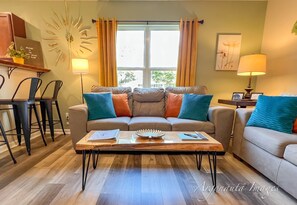 Live edge coffee table and plenty of bar seating.
