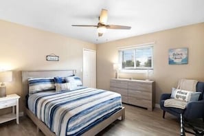 2nd bedroom with Queen Bed, luggage rack, and portable fan for your use as well.