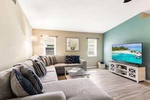 Lounge on the oversized comfy sectional while streaming your favorite shows on the 65" TV