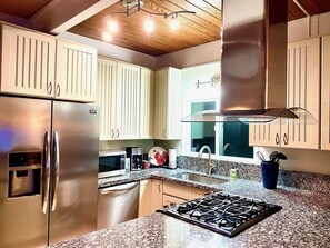 Modern appliances in fully equipped kitchen 