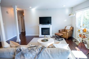 Living room with electric fireplace & apple tv 