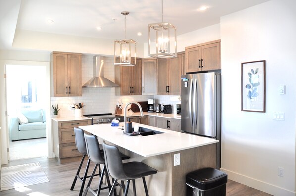 Brand new kitchen with shaker wood cabinets, stone counters and stainless appl.