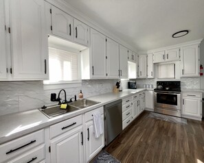This huge kitchen is a dream to cook in!  It's fully stocked with new appliances