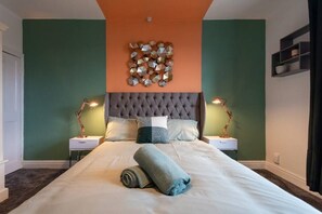 Cozy bedroom featuring a comfortable double bed, your perfect retreat for a restful night's sleep.