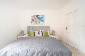 Cozy bedroom 1 featuring a comfortable double bed, your perfect retreat for a restful night's sleep.