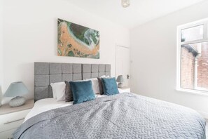 Inviting bedroom 2 with a spacious double bed, designed for ultimate comfort and restful nights.