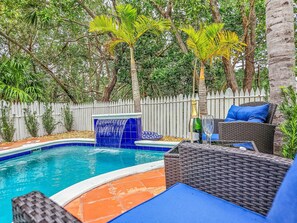 Private custom heated pool with waterfall.