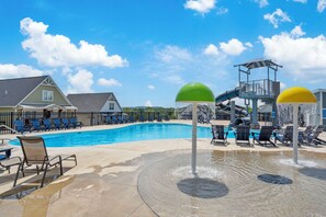 Community Outdoor Seasonal Pool with Splash Pad and Super Cool Water Slide! Lounge Chairs and Restrooms are Available for Guests!