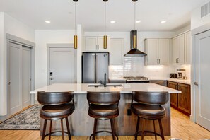 Gorgeous Kitchen Area With Island Bar Seating For 3 People