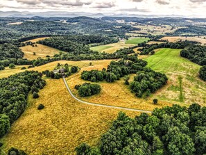 Driveway to Hilltop House showing surrounding private acreage and views.