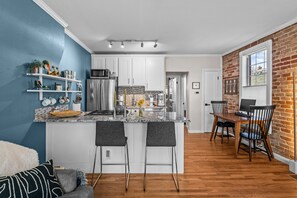 Breakfast Bar and Dining Space (Total Seating for 4) Pictured but not provided: monitor & keyboard