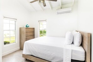A/C, a ceiling fan,  room-darkening shades and garden view