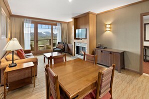 Living, and dining area with Smart TV and gas fireplace. 